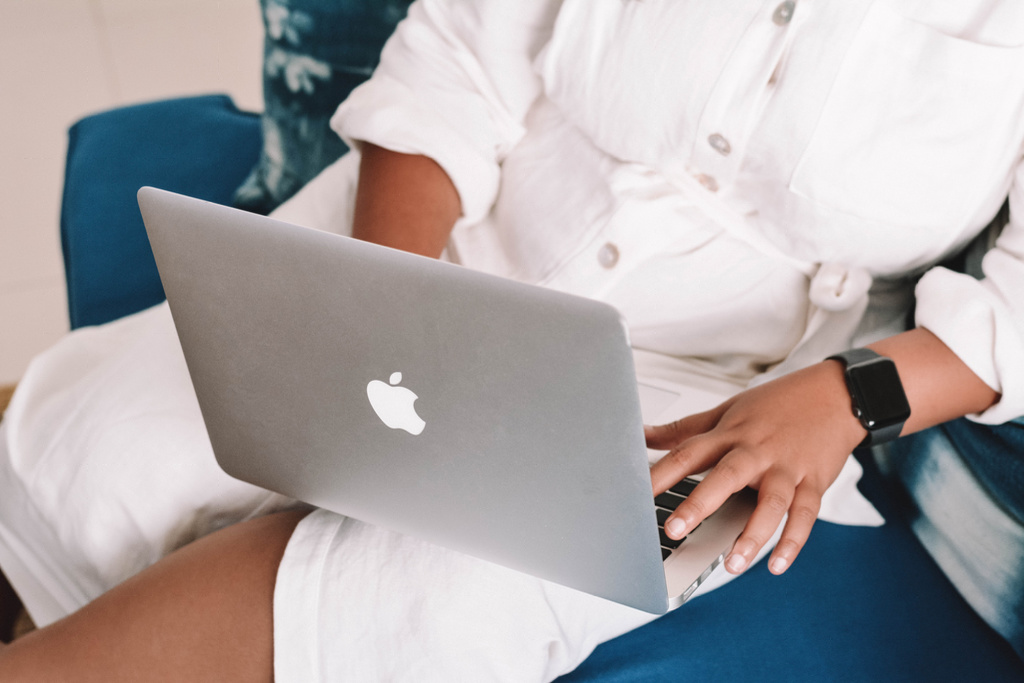 women on a MacBook