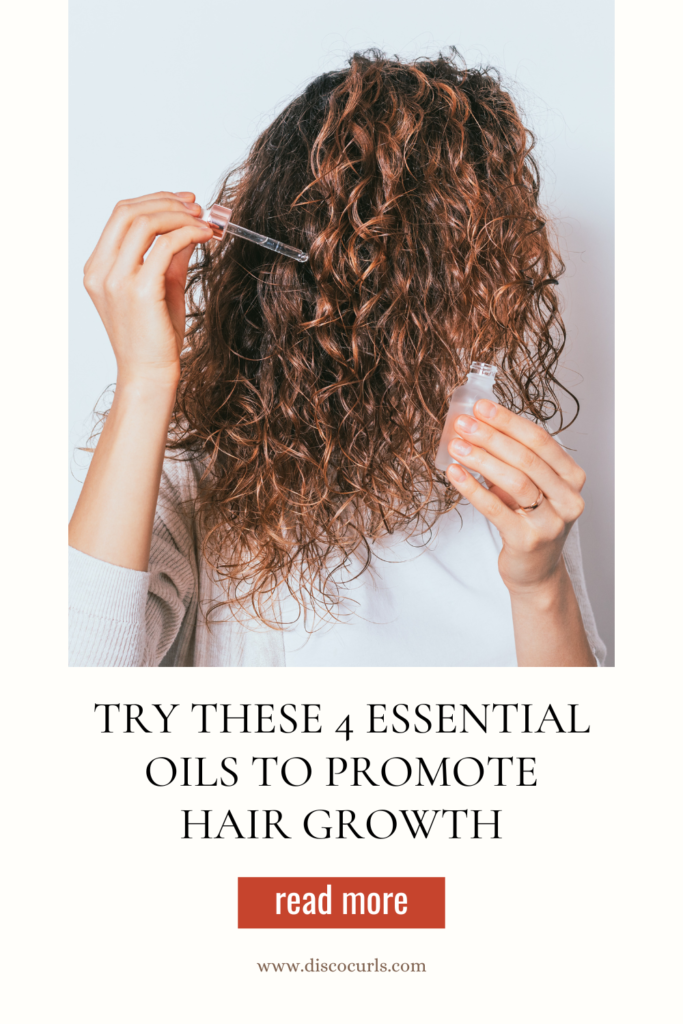 a woman with curly hair applying essential oils to her scalp