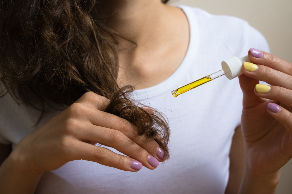 Adding oil to curly hair