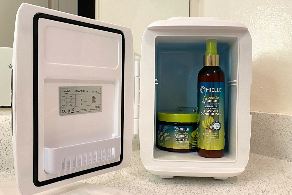 An image of the Mielle Avocado & Tamanu styling products in a skin care refrigerator